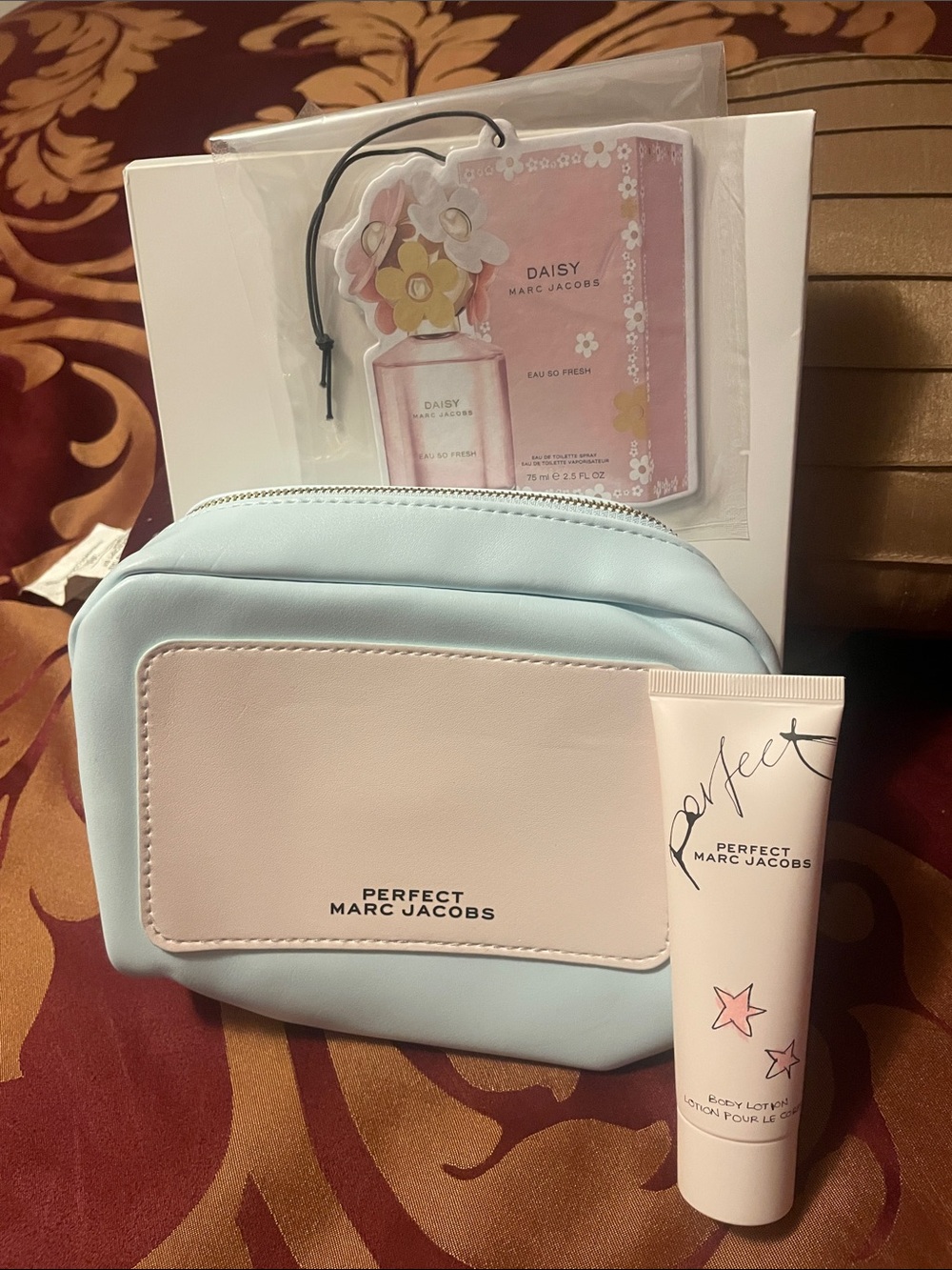 Marc Jacobs pouch, lotion and car freshener